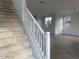 Staircase leading to the upper level, with natural light and open space at 26119 N 23Rd Ave, Phoenix, AZ 85085