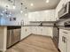 Contemporary kitchen showcasing stainless steel appliances, modern fixtures, and granite countertops at 2821 S Skyline Dr # 156, Mesa, AZ 85212