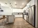 Modern kitchen with stainless steel appliances, white cabinets, and granite countertops at 2821 S Skyline Dr # 156, Mesa, AZ 85212