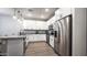 Bright kitchen with white cabinets, stainless steel appliances, granite countertops, and modern flooring at 2821 S Skyline Dr # 156, Mesa, AZ 85212