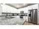 Beautiful kitchen with white cabinets, stainless steel appliances, and a large granite countertop island at 2821 S Skyline Dr # 156, Mesa, AZ 85212