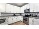 Modern kitchen featuring stainless steel appliances, granite countertops, and ample storage space at 2821 S Skyline Dr # 156, Mesa, AZ 85212