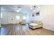 Bright living room featuring modern furnishings, wood-look floors, and white trim at 2821 S Skyline Dr # 156, Mesa, AZ 85212