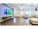 Spacious living room featuring modern furnishings, wood-look floors, and ample natural light at 2821 S Skyline Dr # 156, Mesa, AZ 85212
