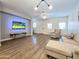 Bright living room featuring modern furnishings, wood-look floors, and a ceiling fan at 2821 S Skyline Dr # 156, Mesa, AZ 85212