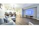 Open concept living room with breakfast bar, modern lighting, and sleek floors at 2821 S Skyline Dr # 156, Mesa, AZ 85212