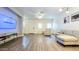 Bright living room featuring modern furnishings, wood-look floors, and ample natural light at 2821 S Skyline Dr # 156, Mesa, AZ 85212