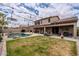 Well-maintained backyard has a pool, covered patio, and lush green grass at 3053 S Canfield --, Mesa, AZ 85212
