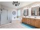 Bathroom with dual sink vanity, soaking tub, shower, and large decorative mirror at 3053 S Canfield --, Mesa, AZ 85212