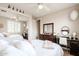 Comfortable bedroom with a dresser, vanity, large bed, and neutral carpet at 3053 S Canfield --, Mesa, AZ 85212