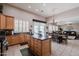 Eat-in kitchen with tile floors, an island, wood cabinets, and modern appliances at 3053 S Canfield --, Mesa, AZ 85212