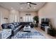 Spacious living room with tile flooring, large windows, and a comfortable seating arrangement at 3053 S Canfield --, Mesa, AZ 85212