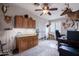 Office with desk, mounted deer, ceiling fan, cabinets, and neutral carpet at 3053 S Canfield --, Mesa, AZ 85212