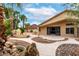 Private backyard featuring a stone water feature, an outdoor grill, and a covered patio at 3700 N 149Th Ln, Goodyear, AZ 85395