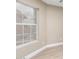 Bright bedroom featuring a large window, neutral paint, and wood-look flooring at 3700 N 149Th Ln, Goodyear, AZ 85395