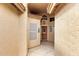 View of the entryway featuring a secure courtyard and decorative wall accents at 3700 N 149Th Ln, Goodyear, AZ 85395