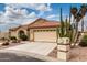 Attractive single-story home with a two-car garage, desert landscaping, and concrete driveway at 3700 N 149Th Ln, Goodyear, AZ 85395