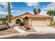 Charming single-story home featuring a two-car garage, desert landscaping, and a red tile roof at 3700 N 149Th Ln, Goodyear, AZ 85395