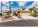 Charming single-story home featuring a two-car garage, desert landscaping, and a red tile roof at 3700 N 149Th Ln, Goodyear, AZ 85395