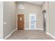 Inviting foyer with tile flooring, high ceilings, and a view of the front door at 3700 N 149Th Ln, Goodyear, AZ 85395