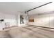Spacious garage with ample storage cabinets, utility sink, and door to interior at 3700 N 149Th Ln, Goodyear, AZ 85395