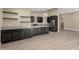 Kitchen with gray cabinets, quartz countertops, and stainless steel appliances at 3700 N 149Th Ln, Goodyear, AZ 85395