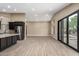 Bright living room with wood floors and sliding glass door at 3700 N 149Th Ln, Goodyear, AZ 85395