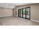 Bright living room with wood floors and sliding glass doors at 3700 N 149Th Ln, Goodyear, AZ 85395