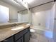 Bathroom featuring a vanity with sink, toilet, bathtub, and a shower at 3930 W Monterey St # 115, Chandler, AZ 85226