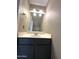 Cozy half bathroom with gray vanity, framed mirror, and modern lighting at 3930 W Monterey St # 115, Chandler, AZ 85226