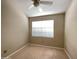 Bedroom with neutral walls, carpet, ceiling fan, and a window at 3930 W Monterey St # 115, Chandler, AZ 85226
