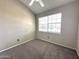 Bedroom showcasing neutral carpeting and window allowing for natural light at 3930 W Monterey St # 115, Chandler, AZ 85226