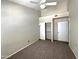 Bedroom with neutral carpet, ceiling fan, and closet with shelving for organization at 3930 W Monterey St # 115, Chandler, AZ 85226