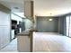 Open kitchen and living space featuring stainless appliances, bar seating, and tile flooring at 3930 W Monterey St # 115, Chandler, AZ 85226