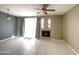 Living room with tile floors, fireplace and ceiling fan at 3930 W Monterey St # 115, Chandler, AZ 85226