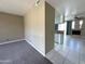 Living room offering open layout, neutral colors, carpeting, and view into the kitchen and fireplace at 3930 W Monterey St # 115, Chandler, AZ 85226