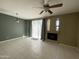Living room with tile floors, fireplace and ceiling fan at 3930 W Monterey St # 115, Chandler, AZ 85226