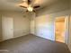 Spacious main bedroom with high ceilings, ceiling fan, ensuite bathroom, and neutral carpeting at 3930 W Monterey St # 115, Chandler, AZ 85226
