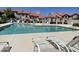 Community pool with lounge chairs and shaded seating area at 3930 W Monterey St # 115, Chandler, AZ 85226