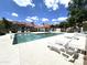 Community pool with lounge chairs and a covered seating area for residents and guests at 3930 W Monterey St # 115, Chandler, AZ 85226