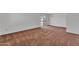 An empty living room, featuring neutral paint, carpet, and a chandelier at 4836 W Rose Ln, Glendale, AZ 85301