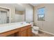 Bathroom with a large mirror, vanity sink and bathtub shower at 523 N Ranger Trl, Gilbert, AZ 85234