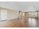 Spacious living room featuring wood laminate floors and staircase access at 523 N Ranger Trl, Gilbert, AZ 85234