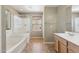 Main bathroom featuring a tub, shower, and vanity sink at 523 N Ranger Trl, Gilbert, AZ 85234