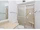 Clean bathroom features a vanity sink, and a shower with glass sliding door at 6041 E Colby St, Mesa, AZ 85205