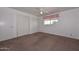 Cozy bedroom with carpet, ceiling fan and natural light from the window at 6041 E Colby St, Mesa, AZ 85205