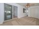 Bedroom featuring carpet, ceiling fan, and sliding glass door at 6041 E Colby St, Mesa, AZ 85205