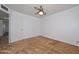 A spacious bedroom with a ceiling fan provides comfortable and functional living space at 6041 E Colby St, Mesa, AZ 85205