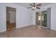 Bright dining area features tile flooring and sliding glass doors leading to the backyard at 6041 E Colby St, Mesa, AZ 85205