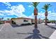 Well-maintained home with desert landscaping and two palm trees, showing nice curb appeal at 6041 E Colby St, Mesa, AZ 85205